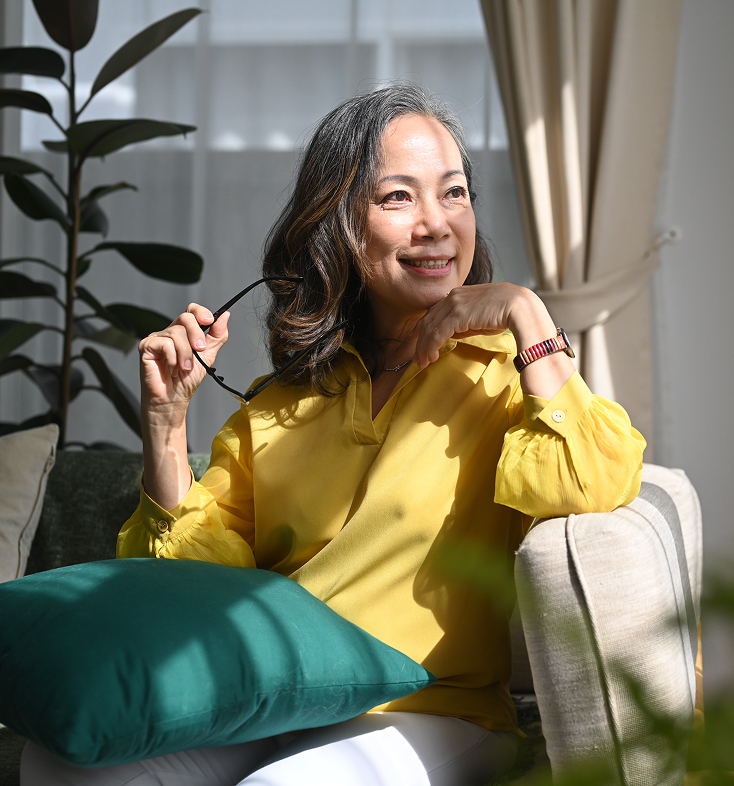 Homeowner relaxing in a bright living room